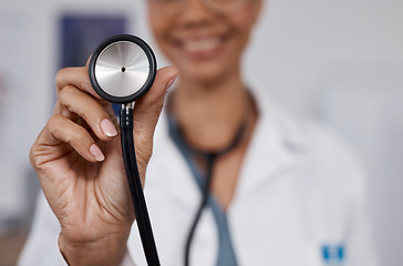 Image showing Cardiology doctor, stethoscope closeup and black woman in healthcare, heart wellness and consultation pov. Friendly medical professional or cardiologist in clinic or hospital exam with happy service