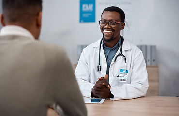 Image showing Black man doctor with patient in consultation office for healthcare advice, services and professional support. Medical worker talking, consulting and discussion with client or person in health clinic