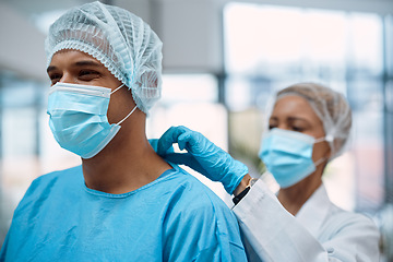 Image showing Surgeon team, doctors and surgery with face mask and health, help with ppe for safety, operation and ready for procedure. Cardiovascular, clean scrubs and people in clinic with physician partnership