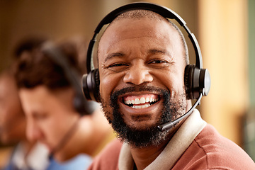 Image showing Face, portrait and smile of black man in call center for customer service work in office. Crm consulting, sales agent and happy telemarketer, representative or male consultant laughing at funny joke.