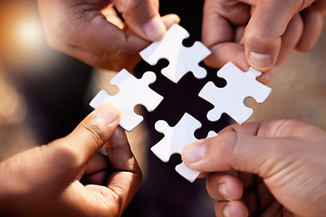Image showing Group hands with puzzle for solution, teamwork and workflow goals, achievement and success in closeup. Team building game, project development and people for problem solving, synergy or collaboration