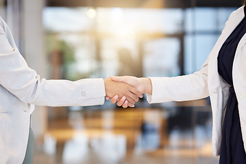 Image showing Handshake, partnership and b2b with business women in agreement of a deal in the office for company growth. Welcome, teamwork or meeting with a female manager and employee shaking hands at work