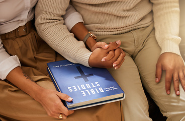 Image showing Love, bible and couple holding hands, studying and support with religious practice, teaching and growth for marriage. Holy text, man and woman bonding, scripture and prayer with connection or healing