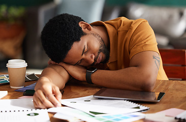 Image showing Tired, exhausted and man sleeping in the office while working on a creative advertising project. Burnout, company and professional African male employee taking nap while planning report in workplace.
