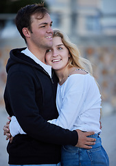 Image showing Love, hug and travel with a tourist couple outdoor together in a foreign country for a vacation or holiday. Trust, tourist or hugging with a young man and woman traveler overseas for a getaway