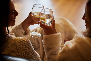 Image showing Women, wine glass and cheers to celebrate together while happy in home to relax, smile and cheers. People or friends toast with alcohol drink in hands for lgbtq, love and care celebration on a couch