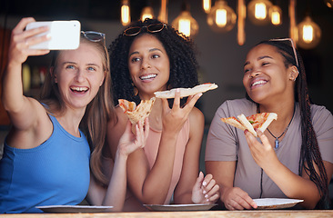 Image showing Woman, friends and pizza for selfie, memory or eating at restaurant together for social media post. Happy women smiling for photo, vlog or profile picture in friendship enjoying food and bonding time
