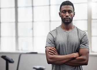 Image showing Black man, portrait and coach in gym with arms crossed for training, exercise and workout in Nigeria. Serious bodybuilder, personal trainer and male in fitness club ready for coaching sports wellness