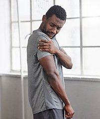 Image showing Shoulder injury, black man and pain in gym from exercise, medical emergency and injured muscle, bruise or joint. Male, arm and fitness accident from workout, first aid and health risk in sports club