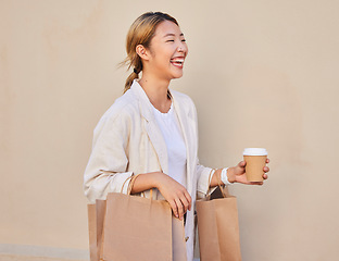 Image showing Coffee, shopping and laughter with an asian woman customer walking outside for a sale or bargain. Smile, retail and comic with a happy young female shopper outdoor for consumerism at a mall