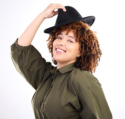 Image showing Black woman, fun hat and studio portrait of a young person laughing in isolated white background. Happiness, smile and female with modern clothes and head accessories feeling happy and relax