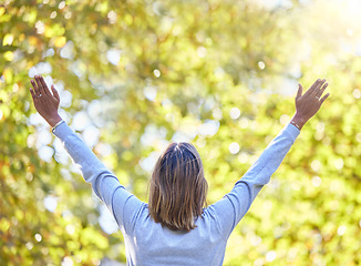 Image showing Woman, park and back with hands in air for nature, gratitude and self care for mindfulness in sunshine. Gen z girl, stretching and sun worship for freedom, zen or wellness to start morning with peace