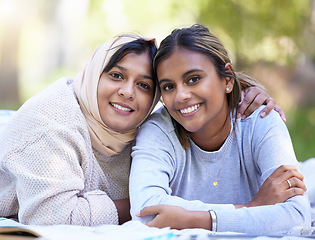 Image showing Muslim women, portrait or hug in park, garden or school campus for relax bonding, friends picnic or community support. Smile, happy or Islamic students in embrace, fashion hijab or university college