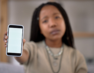Image showing Hands, phone screen and mockup with black woman in home for marketing, advertising or promotion. Tech branding, portrait and female with mobile smartphone for copy space or product placement in house