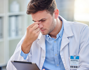 Image showing Headache, stress and tired doctor on tablet with anxiety, pain or overworked for healthcare research. Fatigue, burnout and medical professional frustrated, sad or angry for digital technology problem