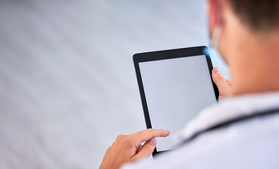 Image showing Doctor, man and hands with tablet on mockup screen above for healthcare research, advertising or marketing at hospital. Hand of male medical expert working on touchscreen display with copy space
