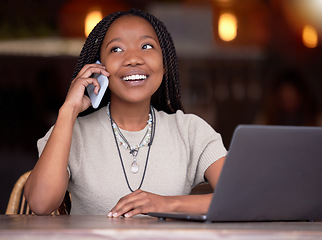 Image showing Black woman, phone call and laptop with smile at cafe for communication, conversation or discussion. Happy African American female freelancer smiling and talking on mobile smartphone by computer