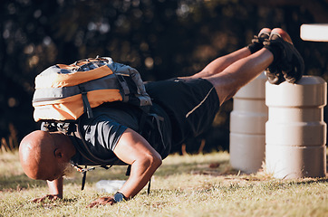 Image showing Pushup, training and black man at a fitness bootcamp for exercise, workout and sports. Strong, bodybuilder and athlete doing a cardio challenge, physical activity and strength routine on a field