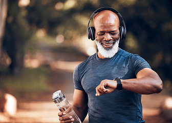 Image showing Black man, music headphones and fitness watch with a water bottle and smile outdoor for cardio time. Senior person outdoor with smartwatch for exercise, workout and training for health and wellness