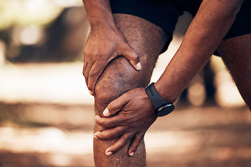 Image showing Knee pain, senior hands and injury in nature after accident, workout or training. Sports, athlete health and elderly black man with fibromyalgia, inflammation or tendinitis, arthritis or painful legs