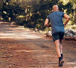 Image showing Back, black man and sports running in park, nature and forest for workout, training or exercise mockup. Sports male, runner and behind of outdoor fitness for energy, health or wellness on garden path