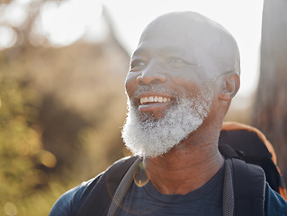 Image showing Happy hiking, senior black man and nature walking, forest adventure or outdoor travel journey. Person or elderly hiker with backpack trekking in woods for retirement health, fitness and wellness