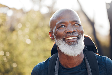 Image showing Nature, hiking and senior black man in walking fitness, forest adventure or outdoor travel journey. Elderly hiker person trekking in woods for retirement health, cardio wellness and carbon footprint