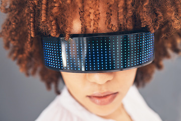 Image showing Fashion, cyberpunk and glasses with a black woman in studio on a gray background for futuristic style. Eyewear, future and modern with an attractive young female wearing a trendy or digital visor