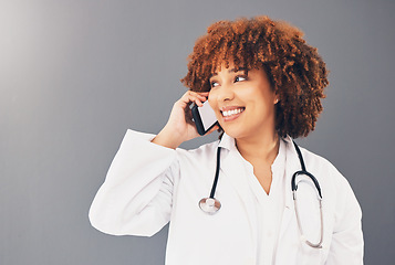 Image showing Consulting, thinking and doctor on a phone call for healthcare isolated on a grey studio background. Contact, happy and black woman speaking on a mobile for medicine, consultation and medicare