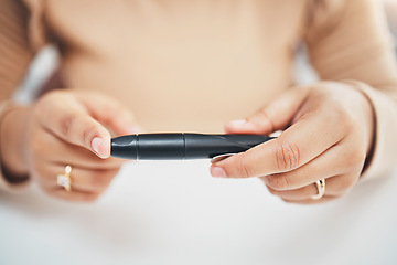 Image showing Diabetes, hands of woman and blood sugar needle test on finger, healthcare and medicine in home. Health, innovation and technology, diabetic person with digital hand glucometer checking glucose level