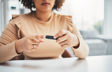 Image showing Diabetes, finger of black woman and blood test in hands, healthcare and medicine in home. Health, innovation and technology, diabetic person with digital glucometer checking glucose or sugar level.