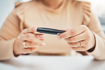 Image showing Diabetes, hands of black woman and blood test on finger, healthcare and medicine in home. Health, innovation and technology, diabetic person with digital glucometer checking glucose or sugar level.