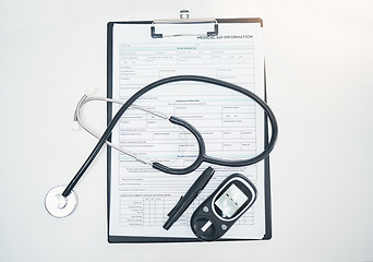 Image showing Stethoscope, medical and diabetes equipment with clipboard from top view for checklist, documents and healthcare. Medicine, research and results with paperwork for insurance, analysis and consulting