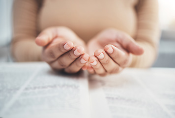 Image showing Worship, prayer and bible with hands of woman for religion, support and Christian faith. Believe, spirituality and God with girl praying over catholic holy text for wellness, respect and hope