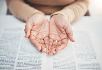 Image showing Faith, prayer and bible with hands of woman for religion, support and Christian worship. Believe, spirituality and God with girl praying over catholic holy text for wellness, respect and hope