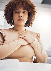 Image showing Black woman, prayer and hands on heart with eyes closed to meditate in home. Praying, spiritual chest and meditation of calm female feeling love, faith and worship for God, Jesus and Holy Spirit.
