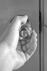 Image showing Turning the Doorknob