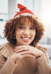 Image showing Santa hat, black woman and portrait of a female at home getting ready for christmas and holiday. House, smile and happiness of a young person celebrating holidays in an apartment with fun accessories