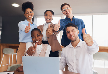 Image showing Business people, laptop and team thumbs up for success, good job or teamwork planning in meeting at office. Group of creative employees by computer showing thumb emoji, yes sign or like for startup