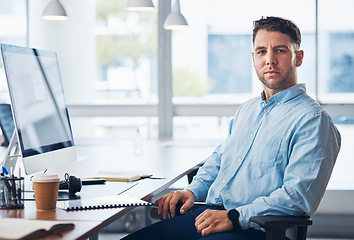 Image showing Businessman, portrait and serious financial advisor by computer with documents in sales sitting by office desk. Corporate male employee by desktop PC on chair ready for finance advice, loan or help