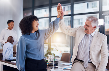 Image showing Business people, high five and celebration for success, collaboration or teamwork at the office. Happy black woman touching hand of senior man CEO celebrating team strategy, management or leadership