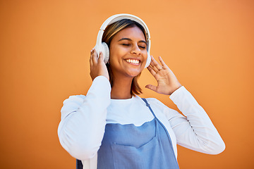 Image showing Mockup, wall and black woman with headphones, smile and streaming music against studio background. African American female, girl and headset for audio, relax and listen to radio, songs and podcast