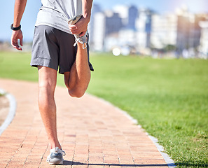 Image showing Wellness, man and stretching legs at beach promenade for exercise, fitness and training. Back of athlete, runner and person warm up body at seaside for summer workout, sports and marathon running