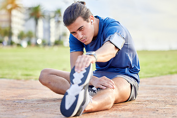 Image showing Beach fitness, health or man stretching leg for cardio exercise running, marathon training or body healthcare goals. Sport mindset, calm peace or focus athlete warm up for outdoor performance workout