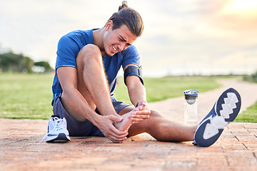 Image showing Fitness, injury and foot pain with man in park for muscle spasm, inflammation and joint problem. Running, workout and exercise with athlete and sports emergency for health, suffering and broken ankle