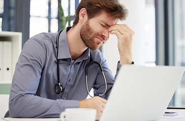 Image showing Headache, stress or man doctor on laptop in hospital feeling pain, burnout or migraine working in office. Medicine, anxiety or medical physician on tech for mental health, depression or surgery fail