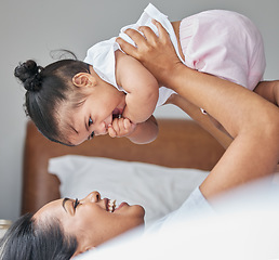 Image showing Love, mother and baby in bedroom, air and care with happiness, playful and cheerful. Mama, female child and kid on bed, smile and bonding together, break and loving with toddler, family and relax