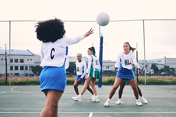 Image showing Fitness, sports and netball match by women at outdoor court for training, workout and practice. Exercise, students and girl team with ball for competition, speed and performance while active at field