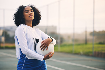 Image showing Sports, netball and portrait of female with a ball after match, exercise or training on the court. Confidence, fitness and serious black woman athlete standing on field for game, workout or practice.