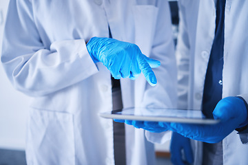 Image showing Tablet, innovation and hands with a team working on research in a lab together for science or growth. Doctor, teamwork or medical with a black man and woman scientist at work in a laboratory